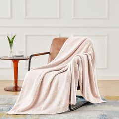 CYMULA pink baby blanket draped on a crib for nap-time warmth.