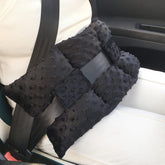 D. Cozy ostomy seat belt pillow front view cushions stoma area for driving comfort.