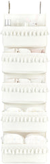 Dahey over-the-door organizer with five pockets in a boho nursery setup, white finish.
