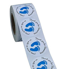Dartsz blue footprint sticker on a baby bottle for guests
