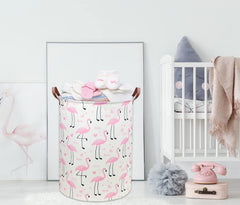DDBASKET Flamingo Pink hamper folded for compact storage in a nursery