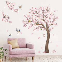 DecalMile cherry blossom tree wall decal branch detail enhances living room decor.