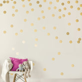 Decals for the Wall gold dots 2-inch wall decal adds a subtle metallic accent.