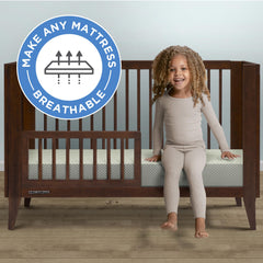 Delta Children breathable crib mattress pad cover side view with secure elastic edges