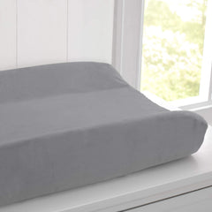 Delta Children changing pad outer vinyl layer is hypoallergenic and waterproof for wipe-clean care