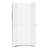 Delta Children Serta foam contoured changing pad on a dresser offers secure, wipe-clean comfort
