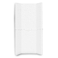 Delta Children Serta foam contoured changing pad on a dresser offers secure, wipe-clean comfort