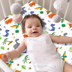 DengFengLai dinosaur crib sheet four-pack laid out, vibrant patterns brighten nursery.