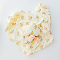 DEZIGKA muslin swaddle blanket in neutral color for versatile nurseries.