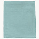 DEZIGKA muslin swaddle sage green blanket featuring soft, breathable fabric for peaceful newborn nights.