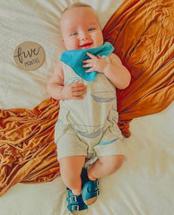 Diaper Squad baby bandana bibs showcase drool-catching designs for stylish meals.