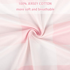 DILIMI pink sheet with edge-to-edge elastic demonstrates secure fit for standard crib