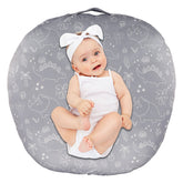 Dilimi newborn lounger cover with dinosaur pattern adds cozy nursery style.