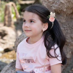 Dizila pink and beige flowers on a stretchy band for versatile styling