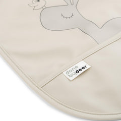Done by Deer sand bib with Happy dots supports tidy eating and cleanup.