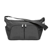 DOONA Essentials Bag Nitro Black attached to the stroller handle for effortless on-the-go storage.