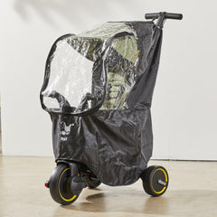 Doona Liki Rain Cover mounted on a trike demonstrates quick snap attachment