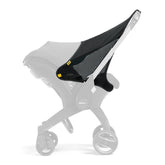 DOONA Sunshade Extension attached to car seat for extra shade and sun protection.