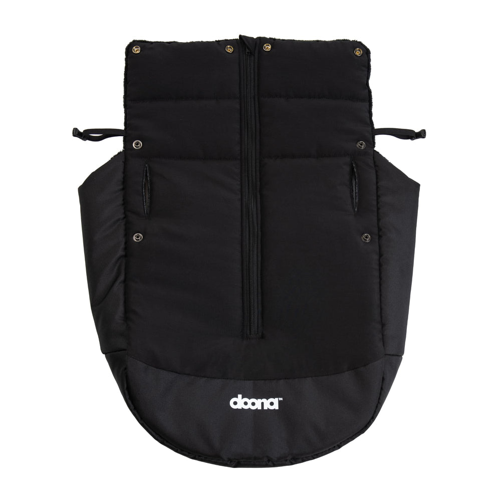 DOONA winter cover over car seat and stroller for warmth during cold walks