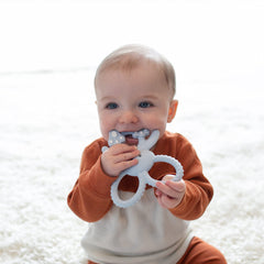 Lightweight bunny teether with easy-to-hold openings for self-soothing.