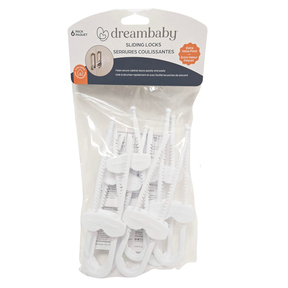Dreambaby sliding locks on a white cabinet, keeping curious kids out