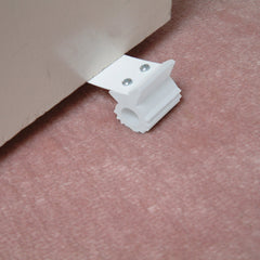 Dreambaby Under Door Gripper close-up reveals flexible rubber material.