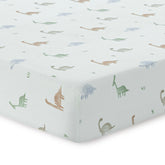 Dreamology dino print crib sheet in a soft cotton muslin finish for gentle baby comfort.