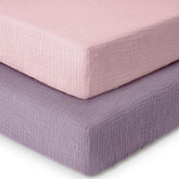 Dreamology muslin crib sheet 2-pack on a standard crib mattress, showing a snug fit.