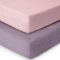 Dreamology muslin crib sheet 2-pack on a standard crib mattress, showing a snug fit.