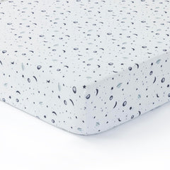Dreamology Planets crib sheet flat lay shows standard 28x52 crib size
