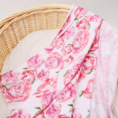 DRESHOW BQUBO baby swaddled in blanket demonstrates secure snug wrap