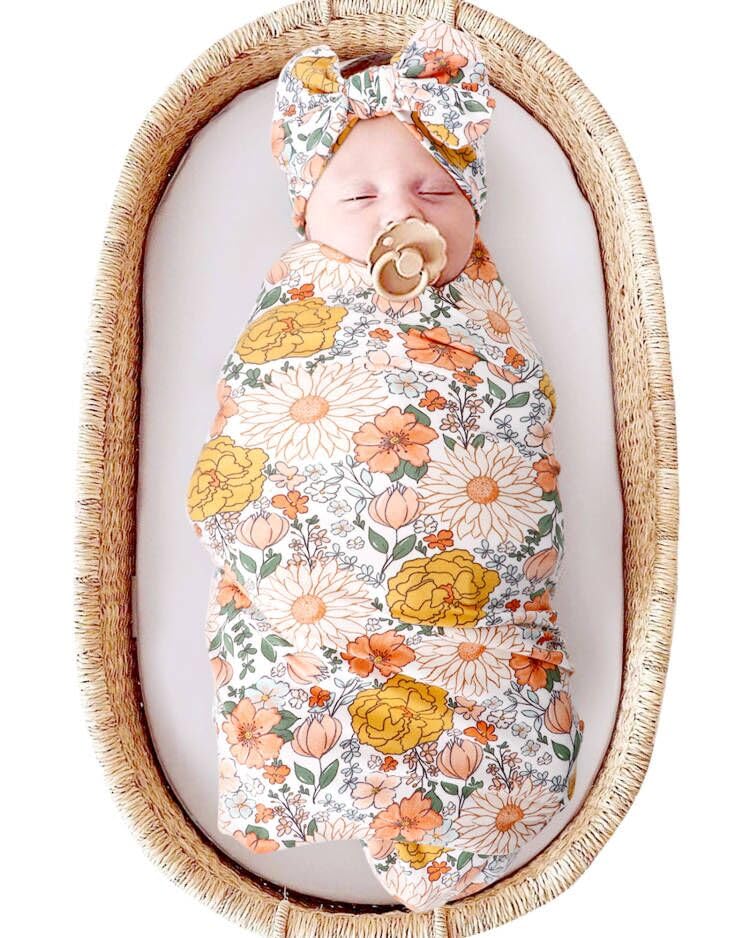 DRESHOW BQUBO floral receiving blanket laid flat for cozy swaddling