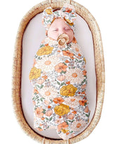 DRESHOW BQUBO floral receiving blanket laid flat for cozy swaddling