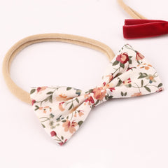 DRESHOW BQUBO newborn turban headband demonstrates soft, stretchy fit for all-day wear.