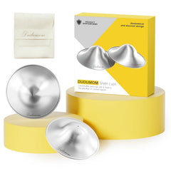 Dudumom Original Silver Nursing Cups closeup in pure 999 silver for gentle breastfeeding comfort.