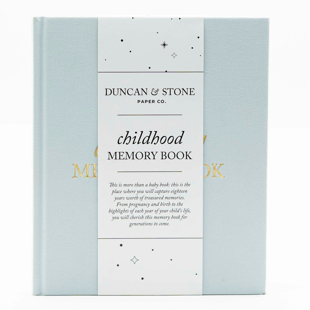 Duncan & Stone Childhood Memory Book cover in sky blue linen with gold embossing.