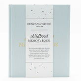 Duncan & Stone Childhood Memory Book cover in sky blue linen with gold embossing.