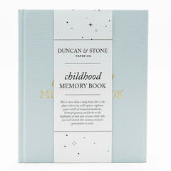 Duncan & Stone Childhood Memory Book cover in sky blue linen with gold embossing.
