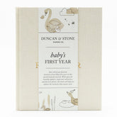 Duncan Stone Paper Co. Baby First Year Book cover in cream linen with gold foil, timeless keepsake.