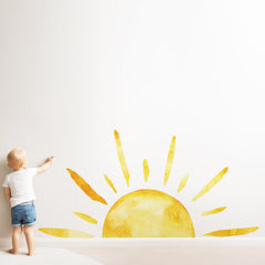 Duocheer half sun wall decal adds warm glow to living room ambiance.