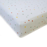 Ecolino dots print crib sheet highlights soft organic cotton for gentle sleep.