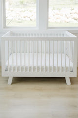 Ecolino organic cotton crib sheet closeup shows combed, ring-spun fibers for durability and softness.