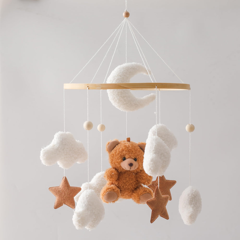 EERKEOD bear nursery mobile featuring a teddy bear aids newborn visual tracking.