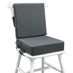 Eiury booster seat on dining table, front view showing secure fit for toddlers.