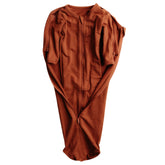 Elovee & Co. rust swaddle fabric close-up, silky and breathable against baby skin
