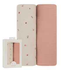 Ely's & Co. muslin swaddle pink garden flower print for gentle baby comfort.