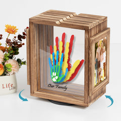 Emfogo baby handprint kit shows bright prints in the brown frame.