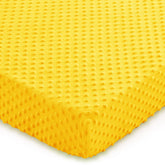 Entisn crib sheet yellow close-up showing soft minky fabric for cozy sleep