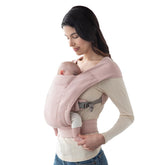 Ergobaby Embrace knit closeup in blush pink shows soft, supportive fabric for baby comfort.