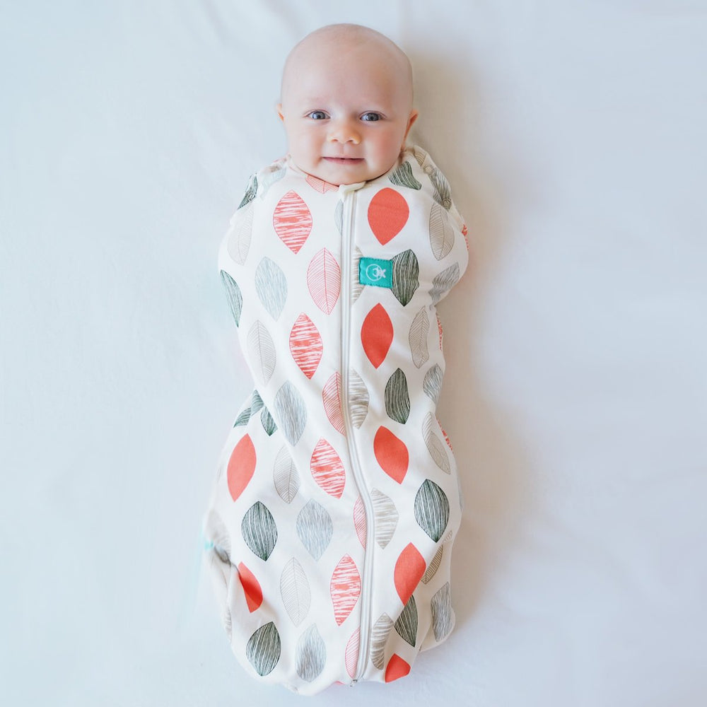 ergoPouch Cocoon Swaddle Sack 0.2 tog Blush Leaf close-up: soft organic cotton for newborn comfort.